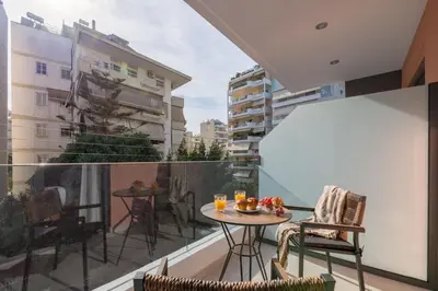 a balcony with a table and chairs on a balcony at Elegant Studio Near Seafront- Palaio Faliro by MPS in Athens