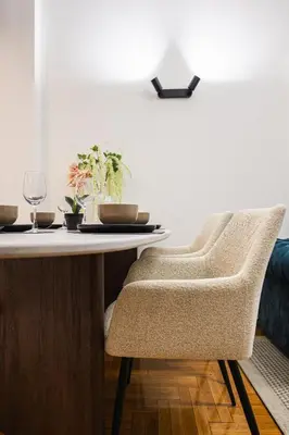 a dining room table with two chairs and a tableablish at Lysé Athens in Athens