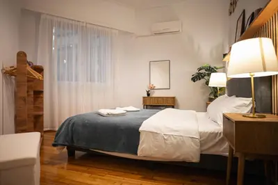 a bedroom with a bed with two towels on it at Lysé Athens in Athens