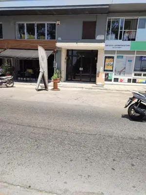 a motorcycle parked in front of a building at By the wave luxurious studios in Piraeus