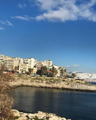 a view of a city and a body of water at By the wave luxurious studios in Piraeus