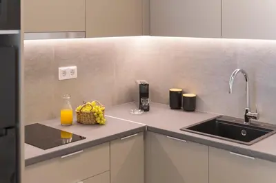 a kitchen with a sink and a fruit basket on a counter at Boutique Studio ΙV in Central Athens by MPS in Athens