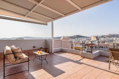a balcony with a view of a city at Panoramic Acropolis View Rooftop Studio by MPS in Athens