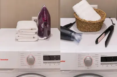 a washing machine with towels and a basket of towels at Elliniko Riviera - 2BDRM Apt - Near Metro by MPS in Athens