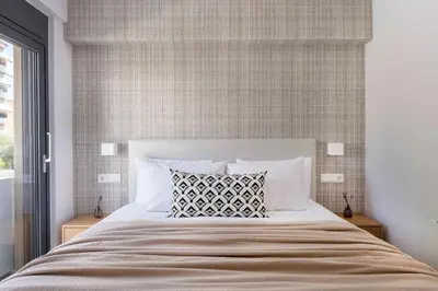 a bedroom with a large bed with two night stands at Elliniko Riviera - 2BDRM Apt - Near Metro by MPS in Athens