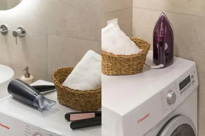 a washing machine with two baskets on top of it at Elliniko Riviera - Family Apt Near Metro by MPS in Athens