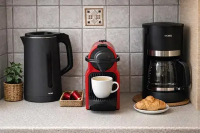 a coffeemaker and a coffee maker on a kitchen counter at Cosy House With Garden Glyfada in Athens