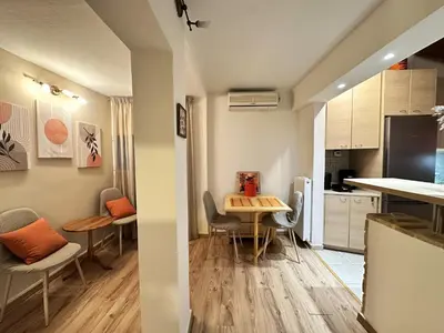 a kitchen and dining room with a table and chairs at Cosy House With Garden Glyfada in Athens