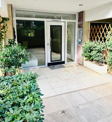 an entrance to a house with a glass door at Athenian Riviera beach apartment in Athens