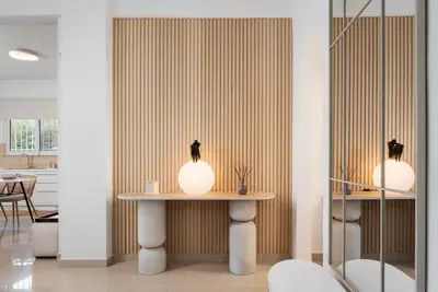a room with a table with two lights on it at Thalè Residence Varkiza in Vari