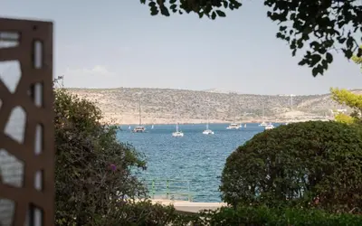a view of a body of water with boats in it at Thalè Residence Varkiza in Vari