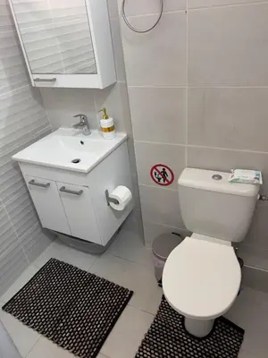 a bathroom with a white toilet and a sink at #Greek Homely Space Βy Marianthi - In the heart of Athens in Athens