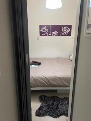 a mirror in a room with a bed at #Greek Homely Space Βy Marianthi - In the heart of Athens in Athens