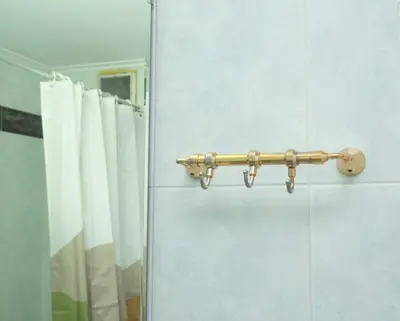 a towel rack in a bathroom next to a mirror at Kassandra lovely floor appartment in Patriarchou Ioakim the heart of Kolonaki in Athens