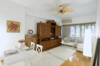 a living room with a table and a dining room at Kassandra lovely floor appartment in Patriarchou Ioakim the heart of Kolonaki in Athens
