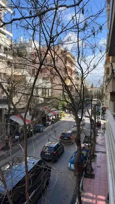 a view of a street with cars parked on the street at Kassandra lovely floor appartment in Patriarchou Ioakim the heart of Kolonaki in Athens
