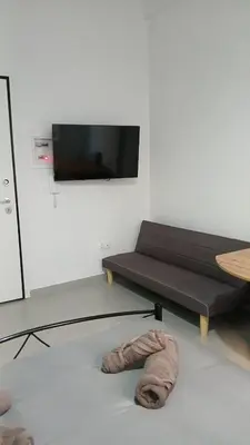a living room with a couch and a table at Athens Apartments, Piraeus Port in Athens