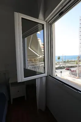 a window in a room with a view of the ocean at Seaview Jazmin Nest in Athens