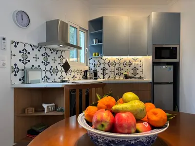 a bowl of fruit on a table in a kitchen at Seaview Jazmin Nest in Athens