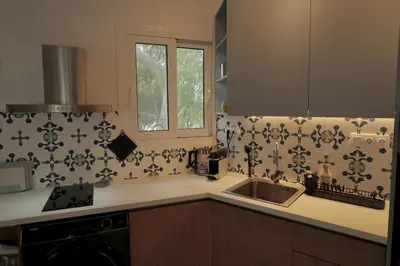 a kitchen with a sink and a counter top at Seaview Jazmin Nest in Athens