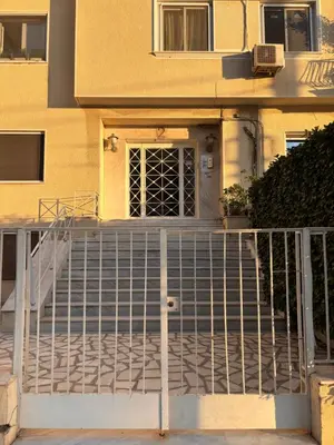 a gate in front of a house with a door at Seaview Jazmin Nest in Athens