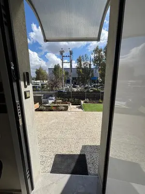 an open door with a view of a parking lot at Athens Air B&B in Athens