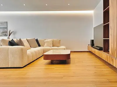 a living room with a couch and a coffee table at Sealine Spacious Apartment in Athens