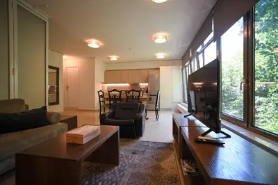a living room with a couch and a table at Tsakalof Luxe by Zeus Suites in Athens