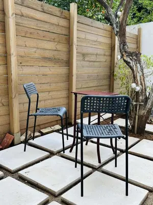 two chairs and a table on a patio at Metro blue line Megaro Mousikis Αpartment in Athens