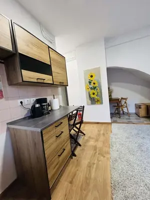 a kitchen with a counter and a dining room at Metro blue line Megaro Mousikis Αpartment in Athens