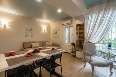 a kitchen and living room with a table and chairs at The 'it' Pagrati Hideout in Athens