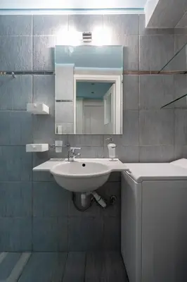 a bathroom with a sink and a mirror at The 'it' Pagrati Hideout in Athens
