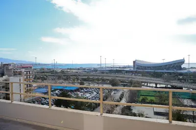 a view of a parking lot from a balcony at Best House Erato Neo Faliro Piraeus in Piraeus