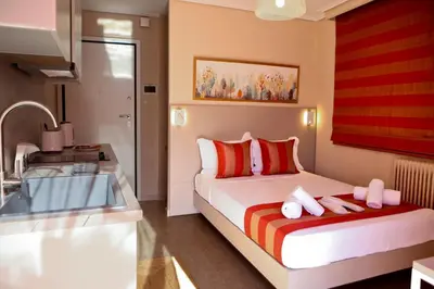 a bedroom with a bed and a sink and a tub at Best House Erato Neo Faliro Piraeus in Piraeus