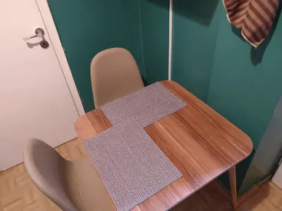 a wooden table with a cross on top of it at Wonderful Central Apartment in Athens