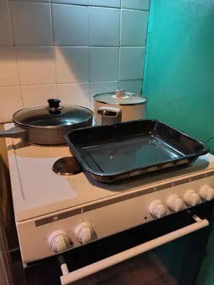 a pan on top of a stove in a kitchen at Wonderful Central Apartment in Athens