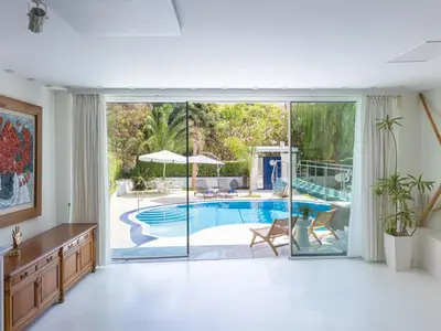 an open living room with a pool and sliding glass doors at Holiday Home Villa Stefani mit privatem Pool by Interhome in Athens