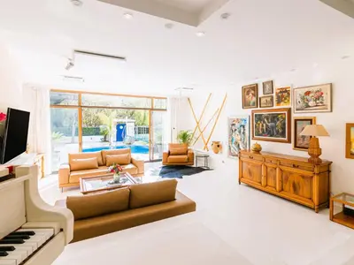 a living room with a piano and a couch at Holiday Home Villa Stefani mit privatem Pool by Interhome in Athens