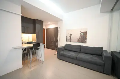 a living room with a couch and a table at Kolonaki Urban Gem by Zeus Suites in Athens