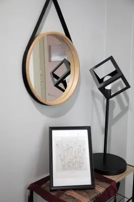 a mirror on a wall next to a table with a picture at Casa Urbana in Athens
