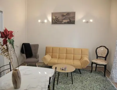 a living room with a couch and a table at Casa Urbana in Athens
