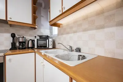 a kitchen with a sink and a microwave at Family 2BRM Flat in Patissia-Acropolis View by ΜΡS in Athens