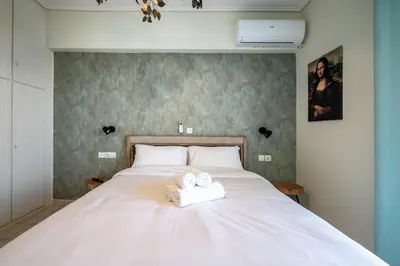 a bedroom with a bed with two towels on it at Family 2BRM Flat in Patissia-Acropolis View by ΜΡS in Athens