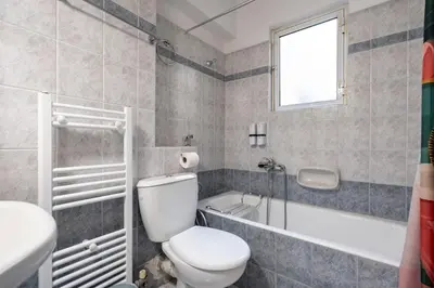 a bathroom with a toilet and a tub and a sink at Family 2BRM Flat in Patissia-Acropolis View by ΜΡS in Athens