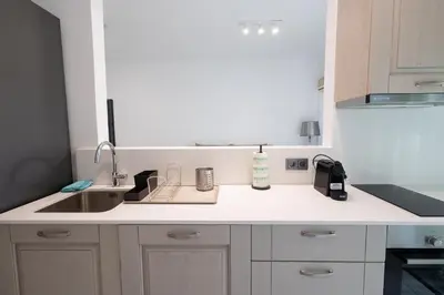 a kitchen with a sink and a counter top at Seaside Home in Porto Rafti