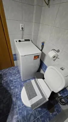 a bathroom with a toilet and a sink at Space One in Piraeus