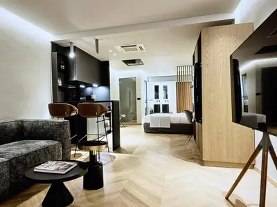 a living room with a couch and a table at Comfort and Relaxation in Athens