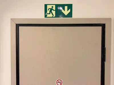 aige door with a sign above it and a sign above it at Elegant Living in Glyfada Center in Athens