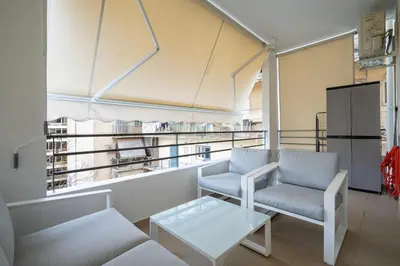 a living room with a chair and a coffee table at Downtown Family Apartment - Walk to Metro by ΜΡS in Athens