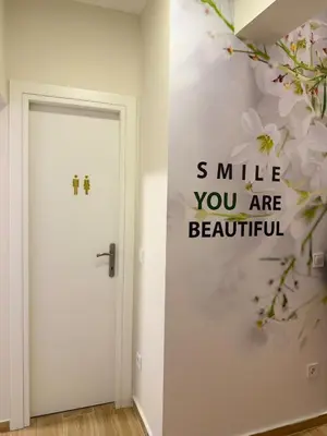 a room with a door with words smile you are beautiful at Paula Acropolis Thissio in Athens